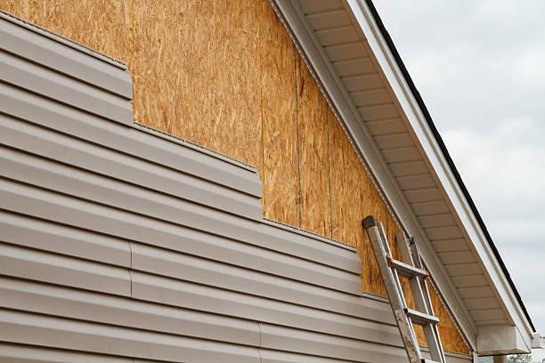 Professional Siding Installation technician working in West Point, KY